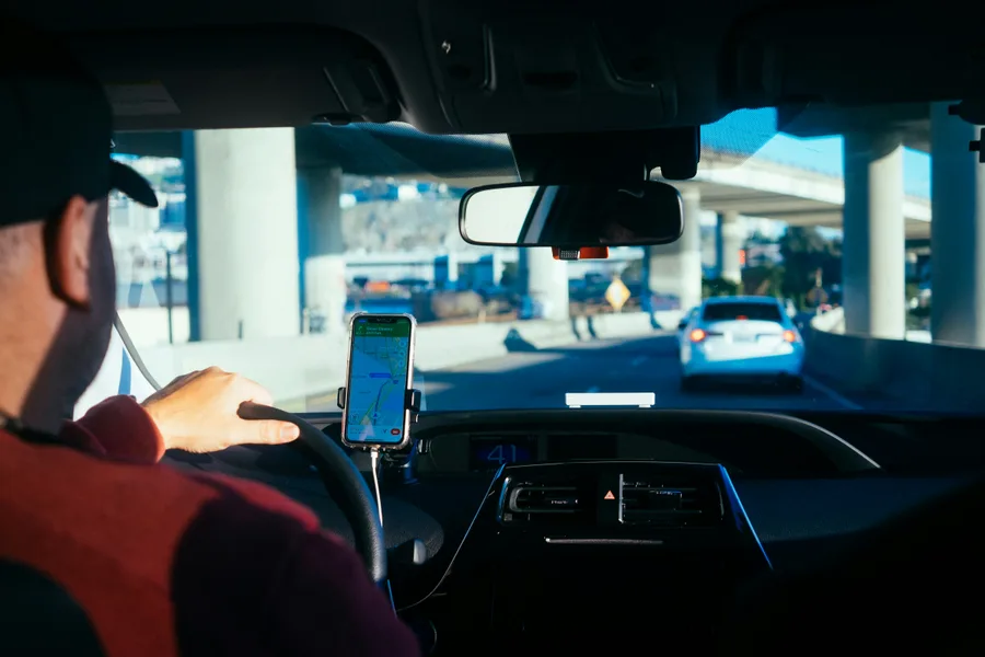 Driver with GPS navigating at night
