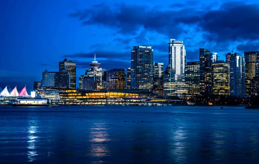Vancouver waterfront skyline at blue hour with Canada Place visible