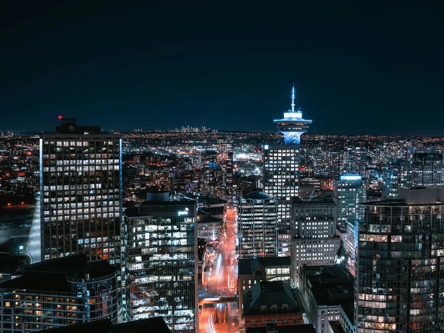 Vancouver downtown skyline at night from above, with the Harbour Centre tower